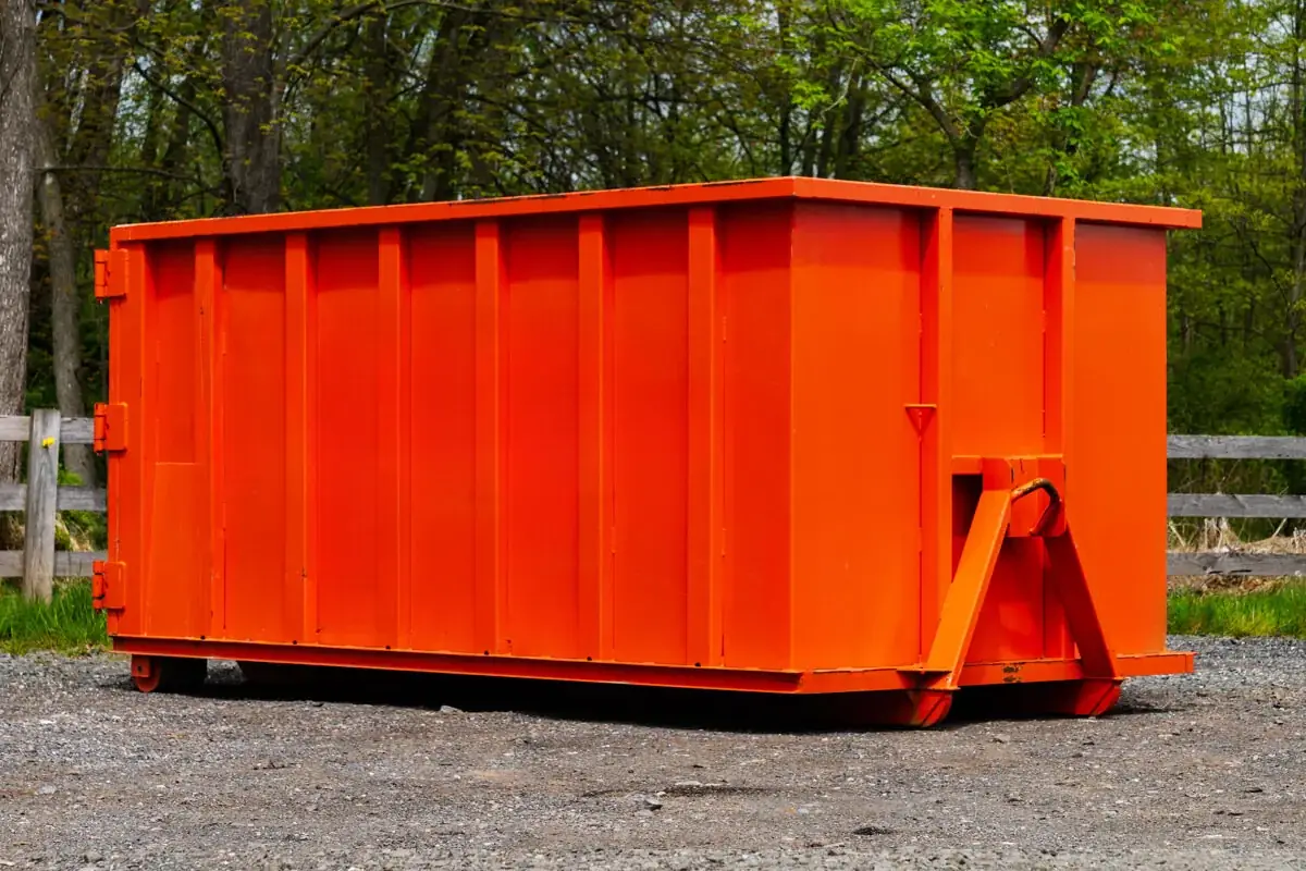 Small 10-yard roll-off dumpster on a gravel pad